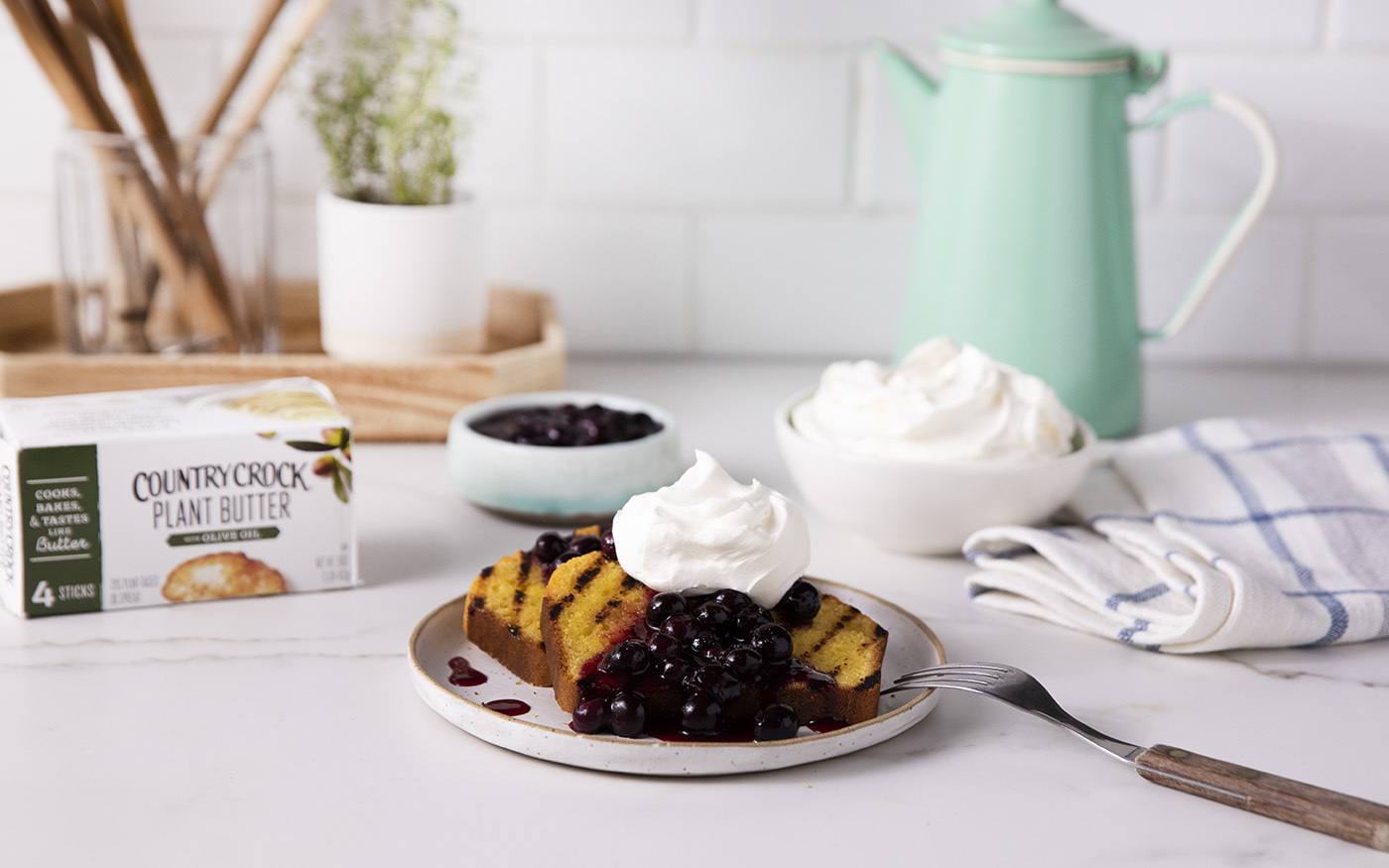 recipe image Grilled Cornbread with Blueberry Compote and Whipped Plant Cream