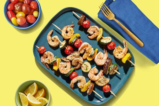 recipe image Artisanal Style Grilled Shrimp Kebabs with Fresh Vegetables and Plant Butter Drizzle