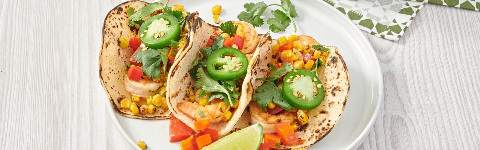 recipe image Grilled Shrimp Tacos with Warm Corn Salsa